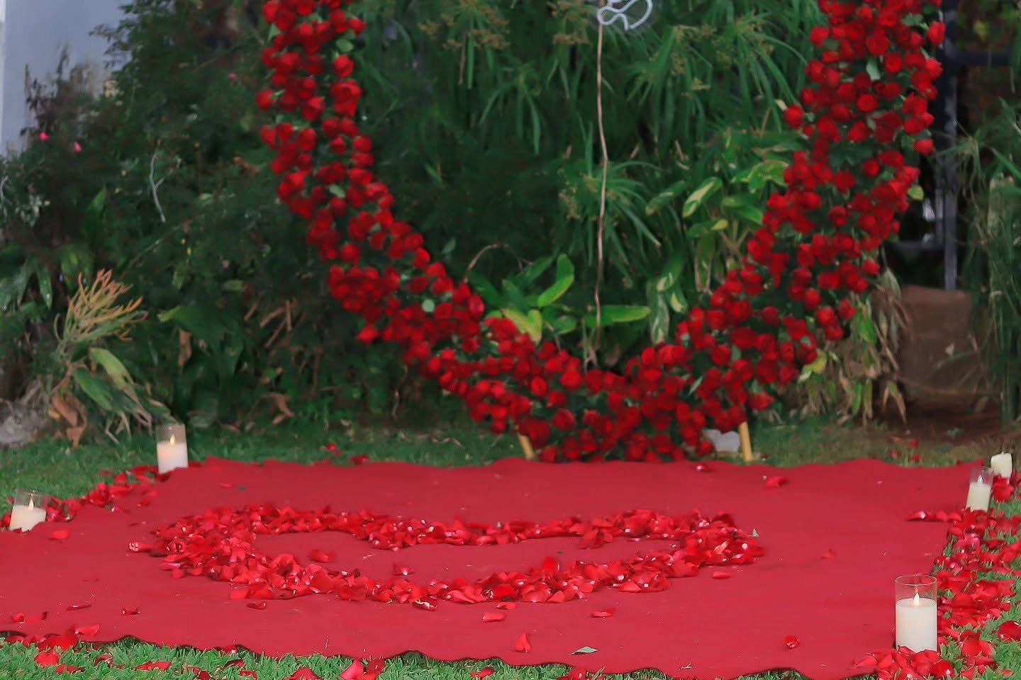 Premier Events & Decor romantic proposal setup with candles and florals